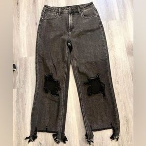 Cute distressed jeans with hold in knees.